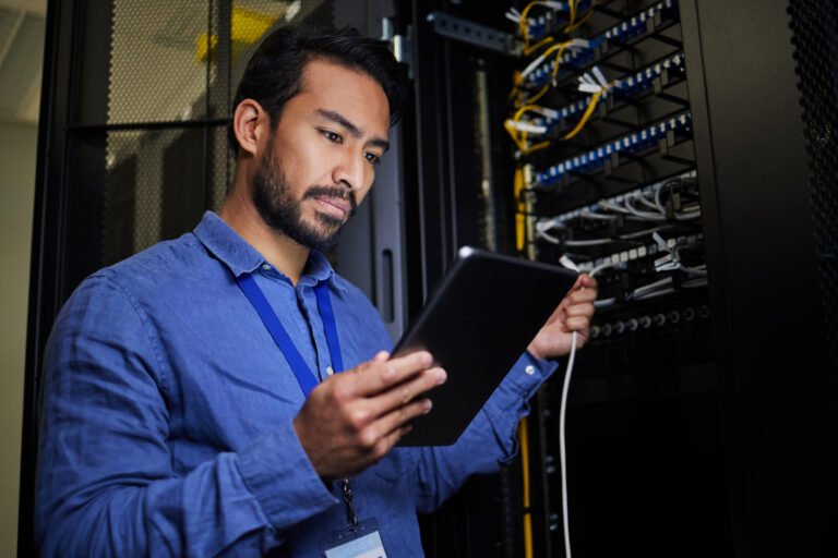 server-room-tablet-engineer-with-connection-cable-maintenance-software-update-night-cybersecurity-it-programmer-coder-man-with-technology-database-networking-data-center