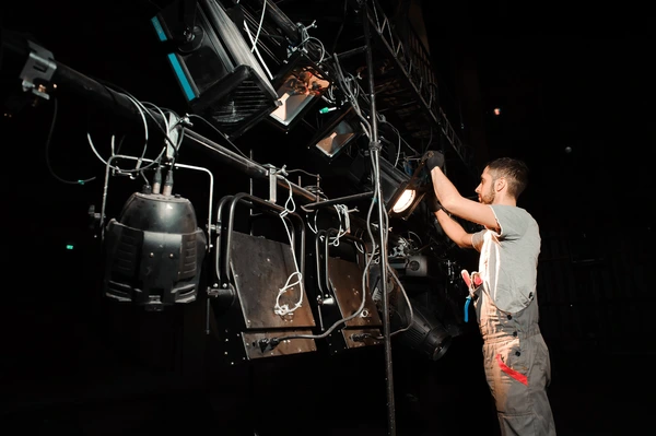 stage-worker-sets-lights-600nw-618665348